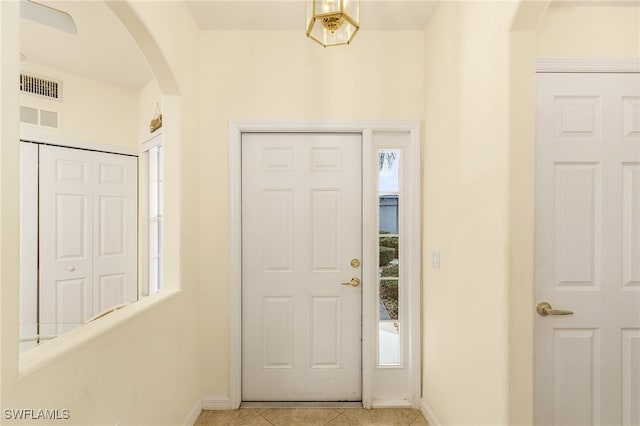 foyer featuring light tile patterned flooring