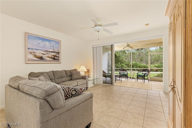 living room with ceiling fan and light tile patterned flooring