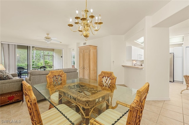 dining area with ceiling fan with notable chandelier and light tile patterned flooring