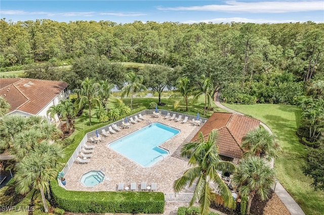 view of pool featuring a yard