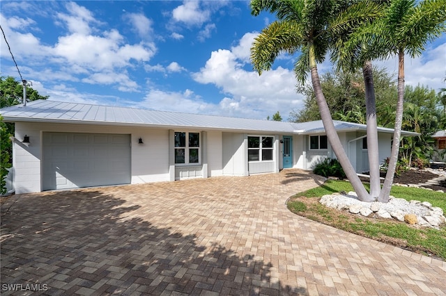 single story home with a garage