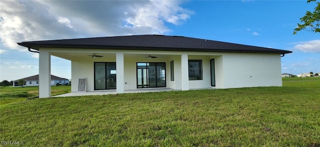 back of house featuring a yard, ceiling fan, and a patio