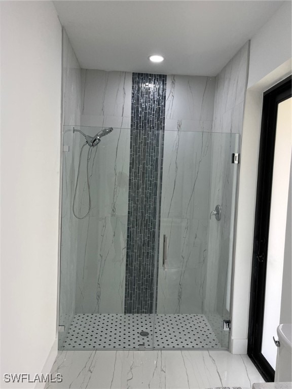 bathroom featuring an enclosed shower