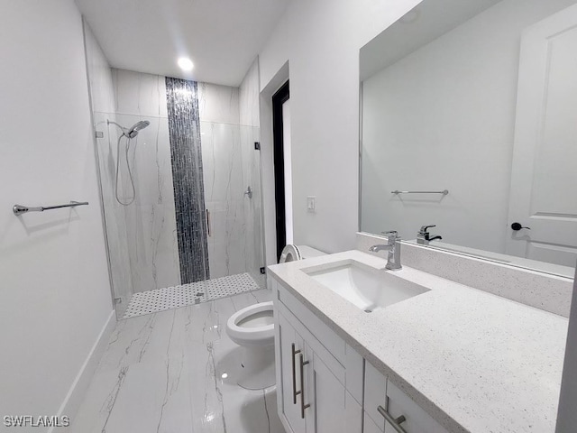 bathroom featuring vanity, toilet, and a tile shower