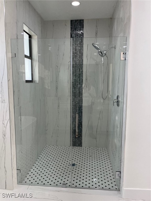 bathroom featuring an enclosed shower