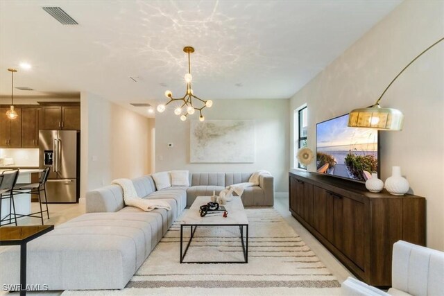 living room featuring an inviting chandelier