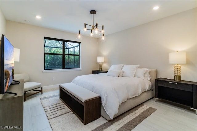 bedroom featuring an inviting chandelier