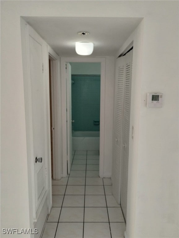 hallway featuring light tile patterned floors