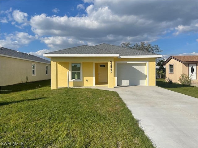 view of front facade with a garage and a front lawn