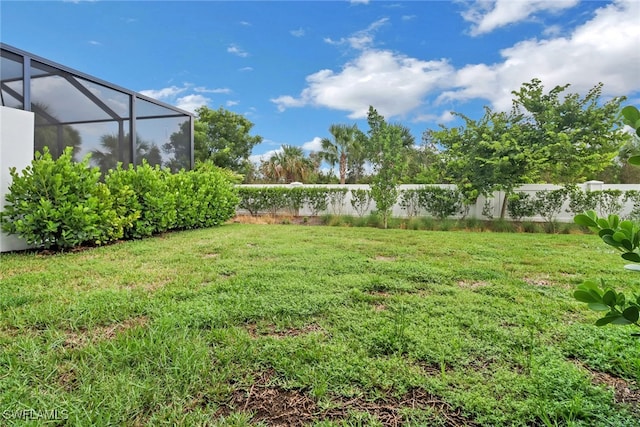 view of yard with a lanai