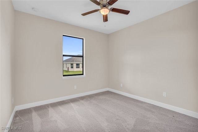 empty room with ceiling fan and carpet flooring