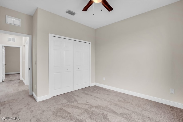 unfurnished bedroom featuring ceiling fan, carpet flooring, and a closet