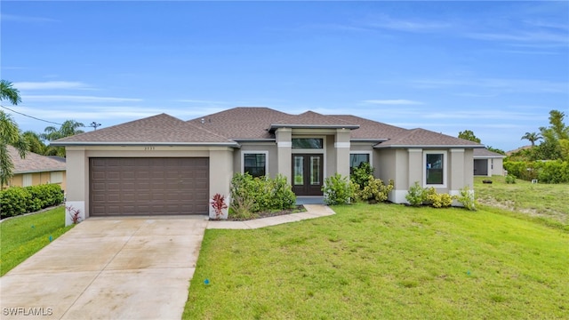 prairie-style house with a front lawn and a garage