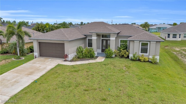 view of front of house featuring a garage and a front yard