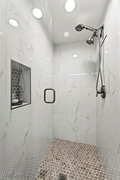 bathroom featuring an enclosed shower