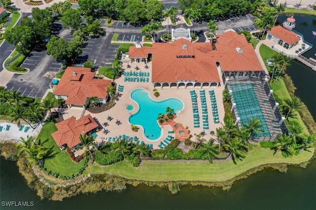 birds eye view of property with a water view