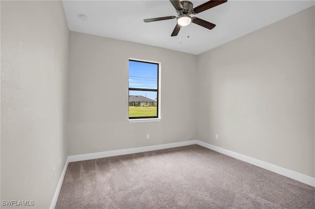 carpeted empty room with ceiling fan