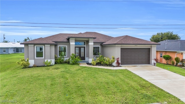 prairie-style house with a front lawn and a garage