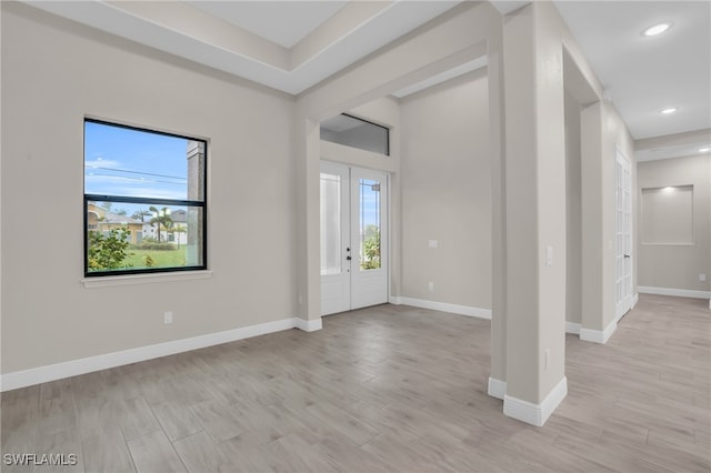 foyer with light hardwood / wood-style floors