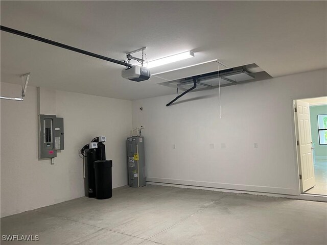 garage with a garage door opener, water heater, and electric panel