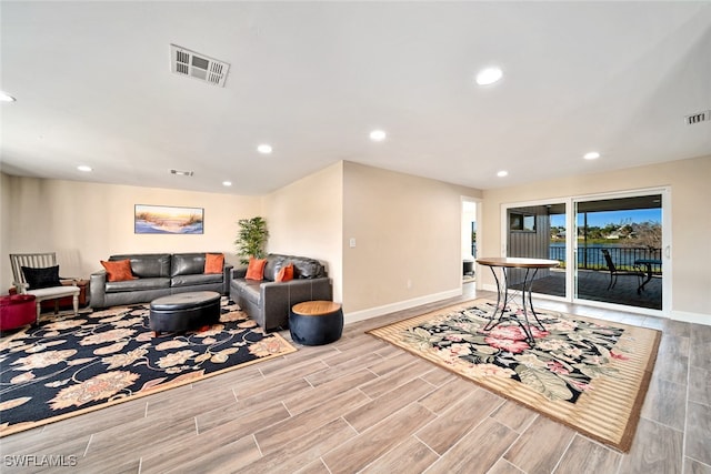 game room with light hardwood / wood-style floors