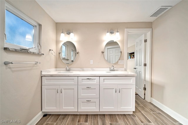 bathroom featuring hardwood / wood-style floors and vanity