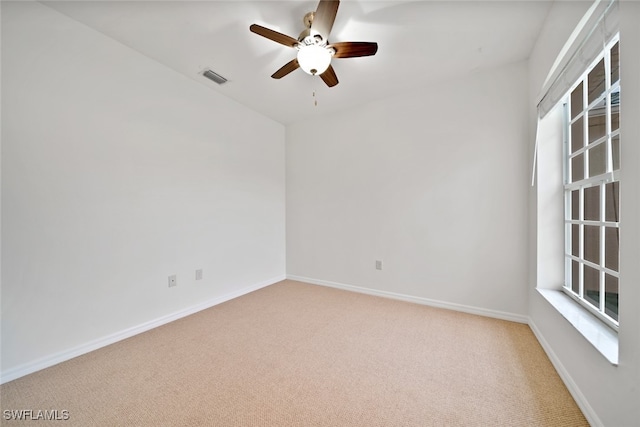 carpeted empty room with ceiling fan