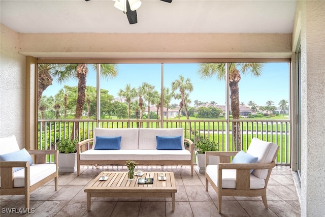 sunroom with a healthy amount of sunlight and ceiling fan