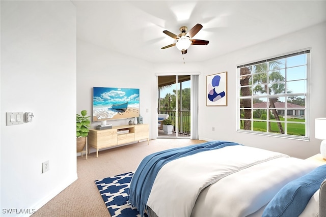 carpeted bedroom with ceiling fan, access to outside, and multiple windows