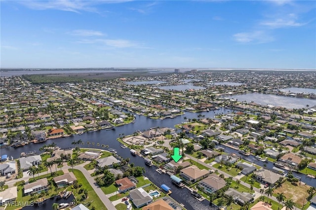 bird's eye view featuring a residential view and a water view