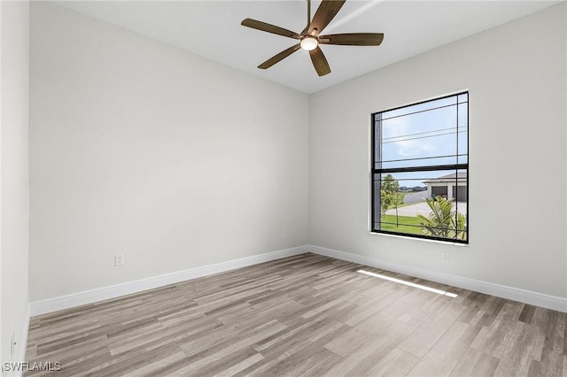 spare room featuring ceiling fan and light wood-type flooring