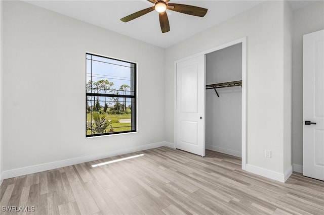 unfurnished bedroom featuring a closet, ceiling fan, and light wood-type flooring