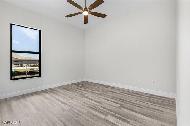 unfurnished room with ceiling fan and light hardwood / wood-style flooring