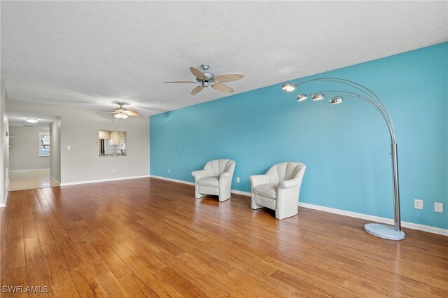 unfurnished room featuring hardwood / wood-style floors and ceiling fan