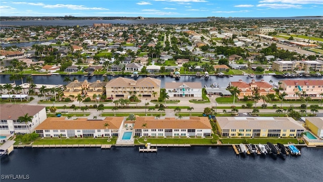 aerial view featuring a residential view and a water view