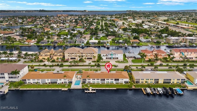 bird's eye view featuring a water view and a residential view