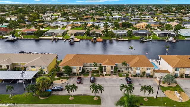 bird's eye view featuring a water view and a residential view