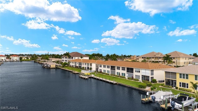 view of water feature with a boat dock, boat lift, and a residential view