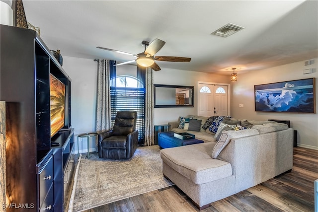 living room featuring ceiling fan and hardwood / wood-style floors