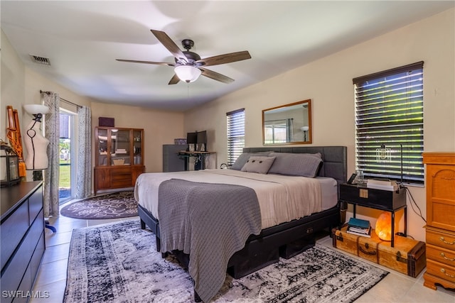 bedroom featuring ceiling fan and light tile patterned floors