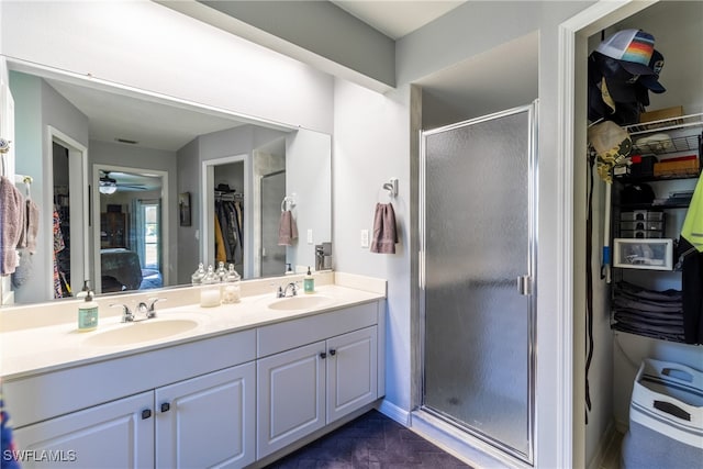 bathroom with vanity, tile patterned floors, ceiling fan, and a shower with shower door