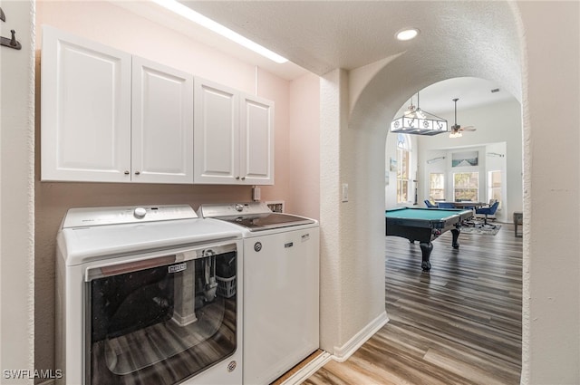 clothes washing area featuring ceiling fan, billiards, washer and dryer, and light hardwood / wood-style flooring