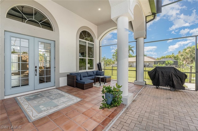 view of patio / terrace featuring french doors, an outdoor hangout area, and a grill