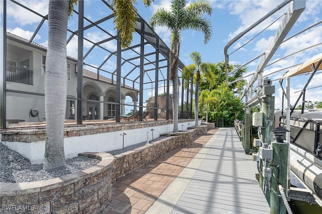 view of patio with a lanai