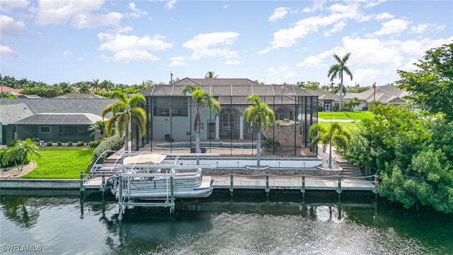 dock area with glass enclosure and a water view