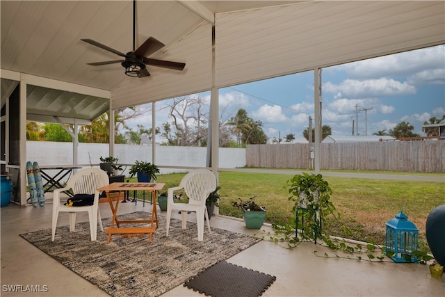 unfurnished sunroom featuring ceiling fan and lofted ceiling