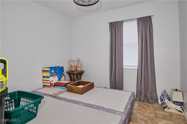 tiled bedroom with a crib