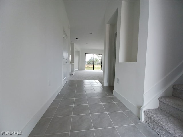 hallway featuring carpet flooring