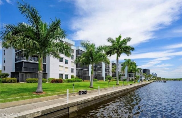 exterior space with a lawn and a water view