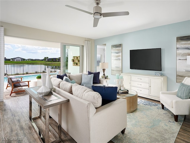 living room with ceiling fan and hardwood / wood-style flooring